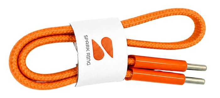An orange braided cord with orange end pieces and silver metal tips, wrapped in a white paper band labeled 'SPARK RING' on a white background.